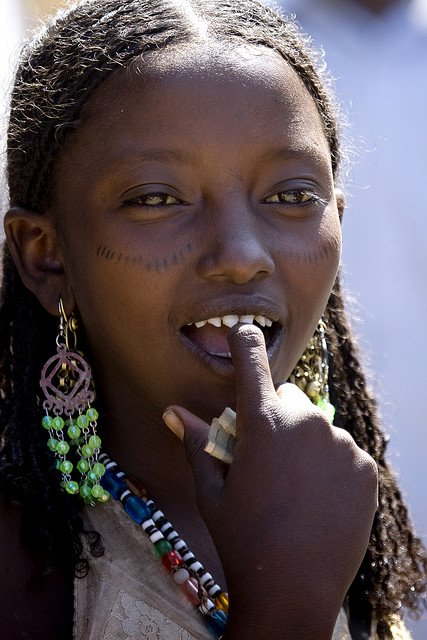 African Body Modification called teeth sharpening young girl